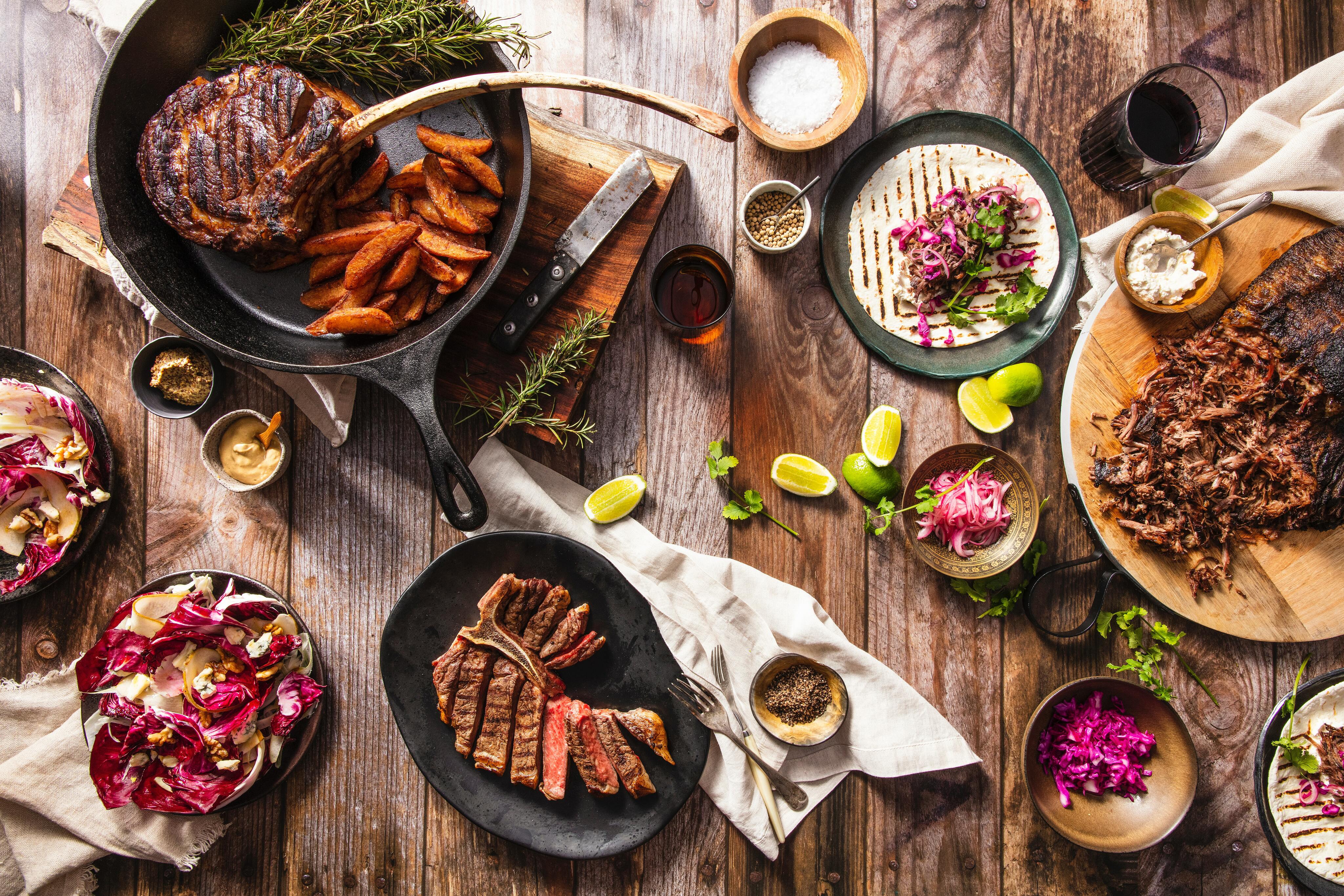 flatlay iron skillet with meat